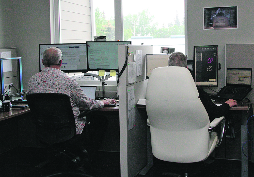 Teachers at work in the Sask DLC head office in Kenaston, Sask. | Distance Learning Corp. photo