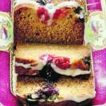 Sprinkle the top of the honey berry cake with raspberries and blueberries, and add the drizzle once it’s cool. | Sarah Galvin photo