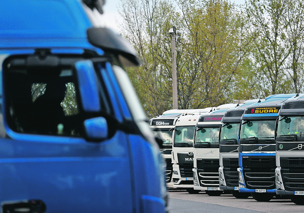 Ukrainian trucks wait at the Hungarian-Ukrainian border this spring. A temporary import ban on Ukrainian grain for the country’s five European Union neighbours ended Sept. 15, but Hungary, Slovakia and Poland unilaterally extended their bans to the dismay of the EU, prompting Ukraine to file a complaint to the World Trade Organization.  |  Reuters/ Bernadett Szabo photo