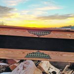 An Alberta farmer combines purposely distressed wood, leather, studs, pieces of barbed-wire and feathers to make works of art such as this leather and wood frame. | Angela Look photo