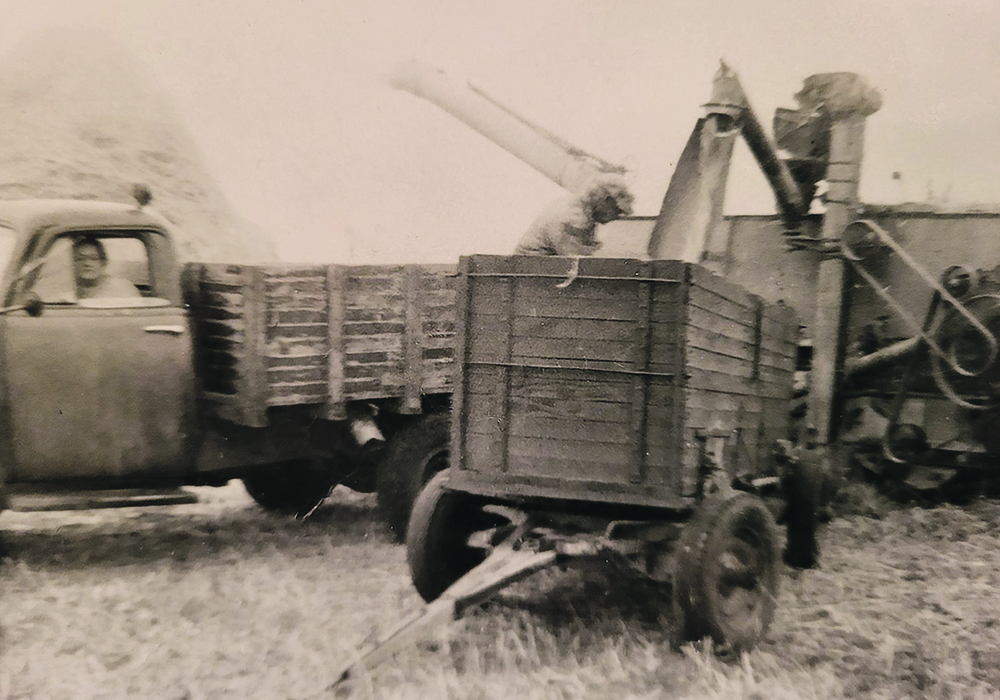 Chris and Muriel Heathcote work together on their farm near Craik, Sask., in the 1950s. | Heathcote family photo