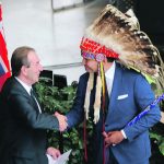 Manitoba agriculture minister Ron Kostyshyn, left, and premier Wab Kinew shake hands during Kostyshyn’s swearing in last month. The new ag minister says rural economic development is critical to the health of the sector in the province. | Ed White photo