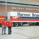 Kerry English, left, and another MF employee pose with the Harvest Brigade parts truck. | Ray Bianchi photo