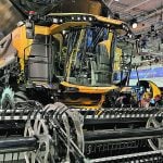 New Holland’s new CR11 combine showcases a significant boost in processing capacity but with the same weight and width as previous models. | John Greig photo