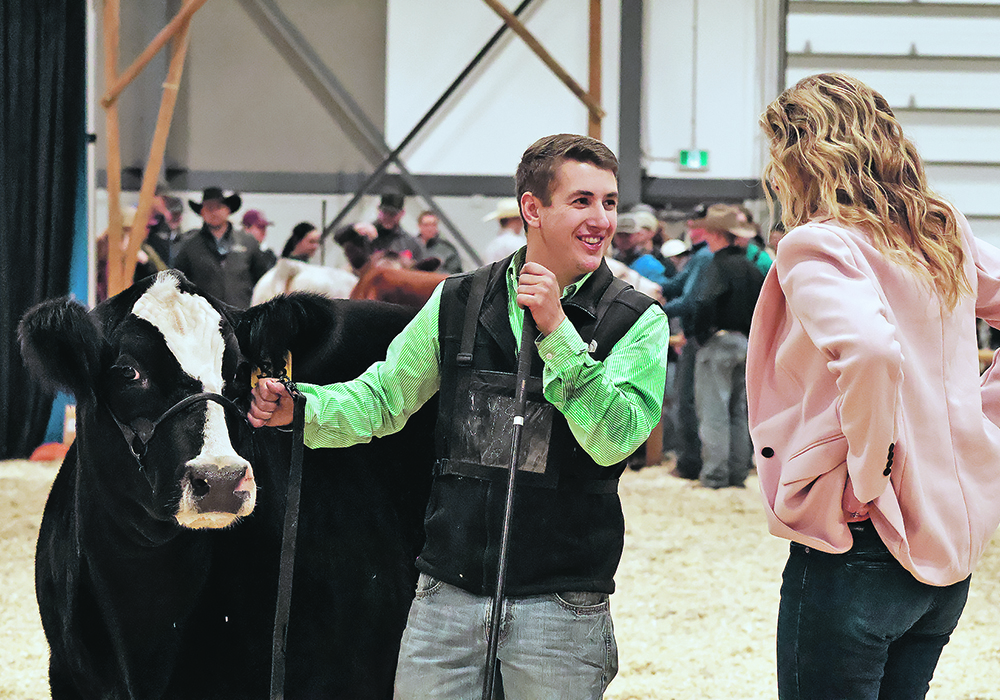 Toby Noble speaks with judge Kirsten Fornwald following his victory with Bar SK Cattle Company’s Black Gold Ms Hayleigh at Canadian Western Agribition’s First Lady Classic Nov. 21.  |  Becky Zimmer photo