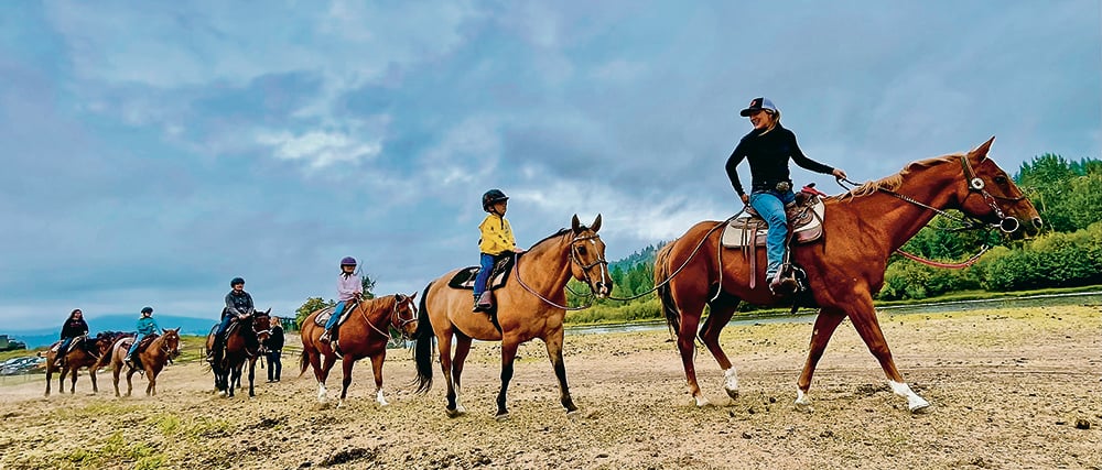 Rae-Lyn Janzen, right, leads a group of trail riders along the St. Mary’s River and up into the scenic Rocky Mountains of B.C. | Christalee Froese photo