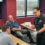 Malting and Brewing Technical Specialist Aaron Onio explains to farmers how germination rates are judged in the malting industry. | Ed White photo