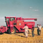 Engineers working on field trials with a 510 combine, circa 1960s. | Ray Bianchi collection photo