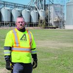 Ernie Penney has changed his farming practices since a serious farm accident more than 20 years ago, making sure the swather table and reels are fully lifted before doing any work and stocking up on new batteries as a safety precaution. | Photo supplied by Ernie Penney