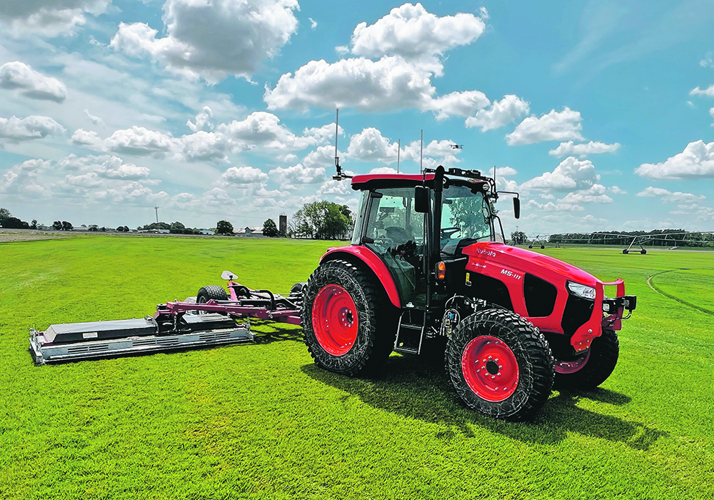 A Kubota M5 tractor equipped with the Sabanto autonomy system mows on a sod farm.  |  Sabanto photo