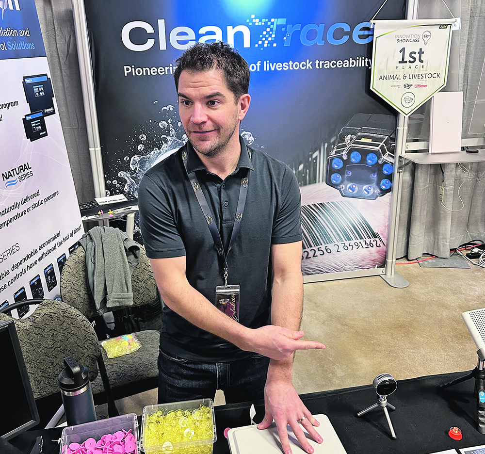 Ellery Burton of CleanTrace says it wasn’t easy to develop a dissolving ear tag that won’t fall apart while on the pig but will disintegrate in hot water.  |  Ed White photo