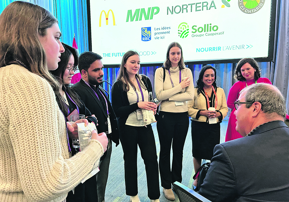 Murad Al-Katib, president of AGT Food and Ingredients, chats with Queen’s University students after his speech at Canada’s Agriculture Day earlier this month.  |  Ed White photo