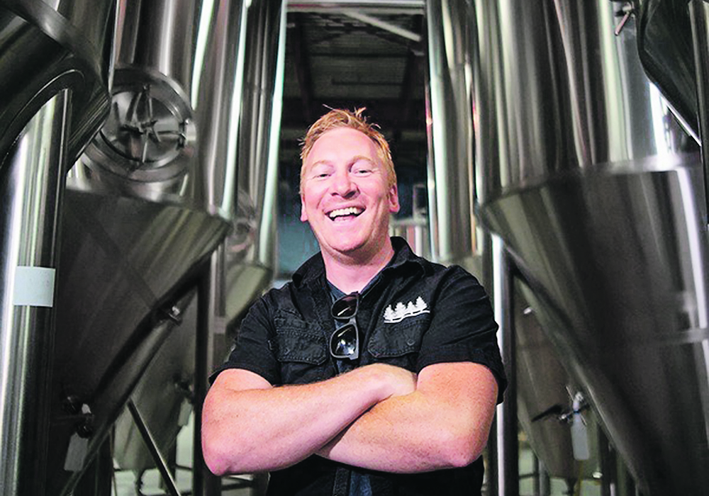 Graham Sherman stands in his brewery, once a distant dream thanks to Alberta’s liquor laws.  |  Photo supplied by Tool Shed Brewing Company