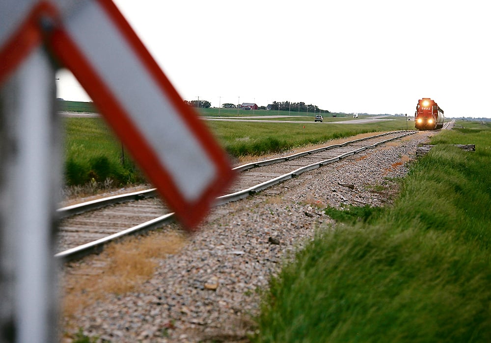 Trains can take up to two kilometres to stop, which makes it important to always obey the signs and signals at railway crossings.  |  File photo