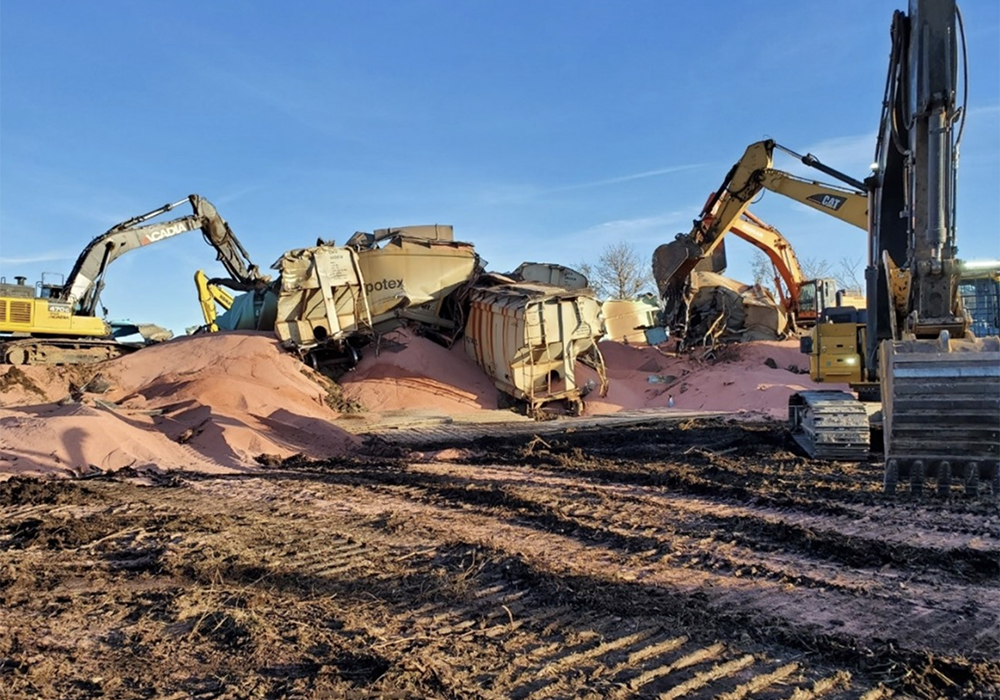 The train was hauling 200 freight cars of potash when 27 of them derailed Oct. 16, 2021. Many of the cars were breached, but there were no injuries and no dangerous goods were involved. | Transportation Safety Board of Canada photo