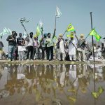 Farmers raise slogans during a grand village council meeting as part of a protest to press for the better crop prices promised to them in 2021. | Reuters/Adnan Abidi photo