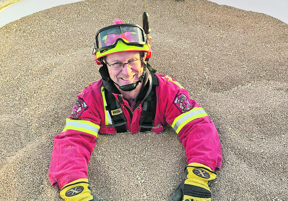 Although Captain Chris Armstrong from the Trochu Fire Department in central Alberta can smile in this controlled situation, entrapment is not a trivial experience. “It’s frightening, it’s claustrophobic, it’s uncomfortable. It’s not a great feeling to have,” said CASA’s Robin Anderson. | Dan Marsellus photo
