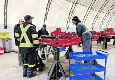 Workers at the Rite Way Manufacturing plant in Regina, Sask., were present during the announcement of the high-tech Careers in Ag Mobile Skills Lab that will begin touring the province this summer.  |  Karen Briere photo