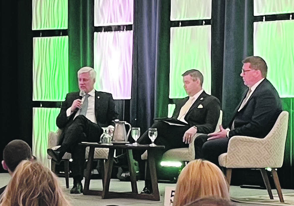 Former prime minister Stephen Harper, left, Saskatchewan export minister Jeremy Harrison and Saskatchewan premier Scott Moe participate in a panel discussion during the Food, Fuel and Fertilizer summit held in Regina last week.  |  Karen Briere photo