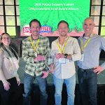Nakamura Farms agronomist Paige Fletcher, left, Ryland Nakamura, Lyndon Nakamura and Georges Dion, Frito Lay’s potato buyer, celebrate the farm receiving an award that recognizes producers with top growing practices, potato quality and record keeping. | Photo supplied by Ryland Nakamura