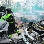 Firefighters work at the site of a Russian air strike in Kharkiv, Ukraine, May 14. | Reuters/Sofiia Gatilova photo