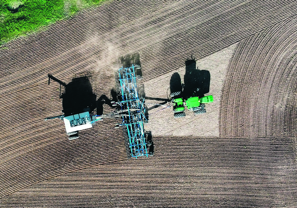 Eric Smith sowing oats at Silver Smith Farms, a grain and cattle property near Byemoor, Alta. on June 4, 2024. Wheat seeding in Canada was a little late but is now mostly in the ground and benefiting from a much improved moisture profile.  |  Annabel O'Dea photo