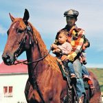 Stephen Low on the horse in the front with his brother Ben at the back of their father Colin in the early 1950s. The white house came from the Cochrane ranch. In the 1990s Low and his wife bought a place near Cochrane across the Belly River near the original ranch as a summer place. | Stephen Low photo