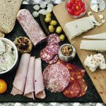Make a simple picnic platter with cucumber yogurt dill salad, devilled eggs, cold sliced meats, sourdough bread, mustards and tomatoes. | Sarah Galvin photo