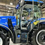 Two-year-old Peter Braun checks out a new tractor at Canada’s Farm Show in Regina last week. He was at the show with his father, James, twin brother Thomas and grandfather, Allan Braun. Starting next year, the show is moving to March. | Karen Briere photo