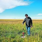 Laio Silva Sobrinho works with a rising plate meter at Olds College’s Technology Access Centre for Livestock Production. | Olds College of Agriculture & Technology photo