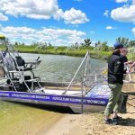 The Sask Polytech wild rice harvester pulls up to the Saskatoon Water Ski Club beach for display late last month. Unlike the typical design, the harvester’s engine sits below the seat rather than above the operator’s head. | Janelle Rudolph photo