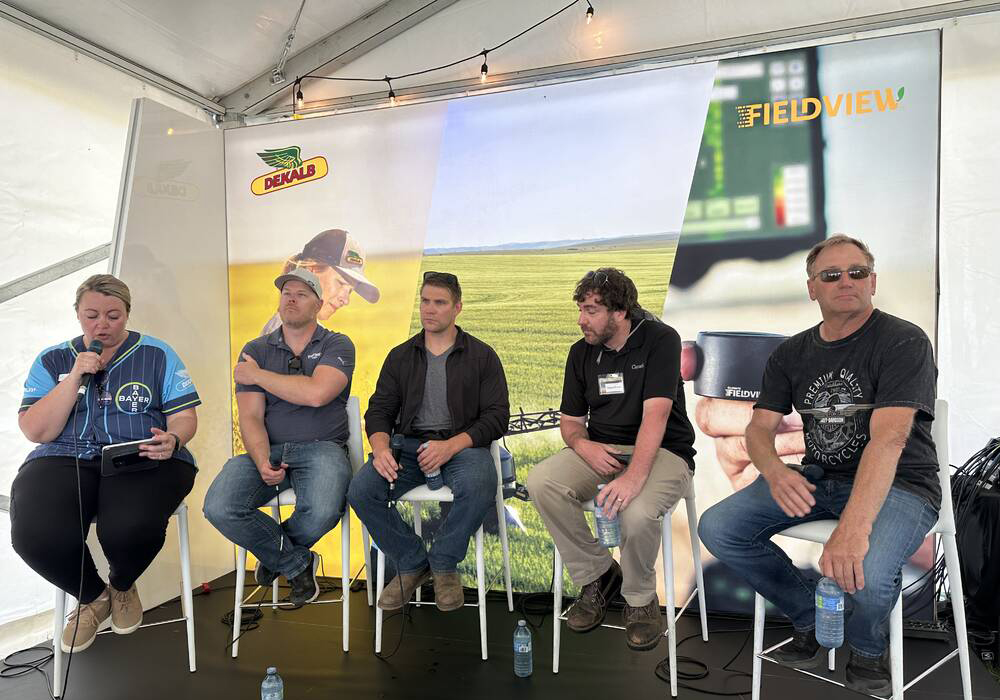 Herbicide resistance discussion panel at the Bayer Crop Science booth at Ag in Motion on Tuesday, July 16. Left to right: Ashley Smith (moderator), Rory Cranston, Chris Mansiere, Shaun Sharpe, Corey Loessin. | Don Norman photo