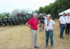 At its 2024 Tech Day held near Salina, Kansas, Agco chief executive officer Eric Hansotia, in the red shirt, and other senior staff sat down for a roundtable discussion, revealing their views on the next major technology to disrupt the ag equipment industry — full autonomy. |   Scott Garvey photo