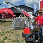 Kolby Woods, of New Standard Ag stands by the Evo Cleaner, a new automated cleaner for livestock barns. | John Greig photo