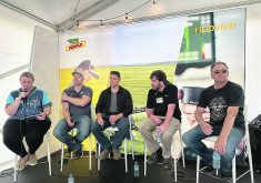 Industry representatives, researchers and farmers discuss the problem of herbicide resistance at the Bayer Crop Science booth at Ag in Motion July 16. Panel moderator Ashley Smith, left, was joined by Rory Cranston and Chris Mansiere of Bayer, Agriculture Canada weed scientist Shaun Sharpe and producer Corey Loessin.  |  Don Norman photo