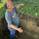 University of Saskatchewan scientist Jeff Schoenau explains his research from a soil pit at last week’s Ag in Motion farm show. | Robert Arnason photo