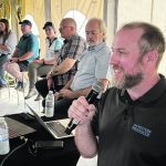 Western Producer editor Robin Booker presents the results of the paper’s 100 farmers, 100 Questions, 100 Years project at last week’s Ag in Motion farm show. | Ed White photo