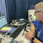 Keith Lundburg of WNAX prepares his next radio broadcoast at the World Pork Expo in Des Moine, Iowa, earlier this summer. | Ed White photo