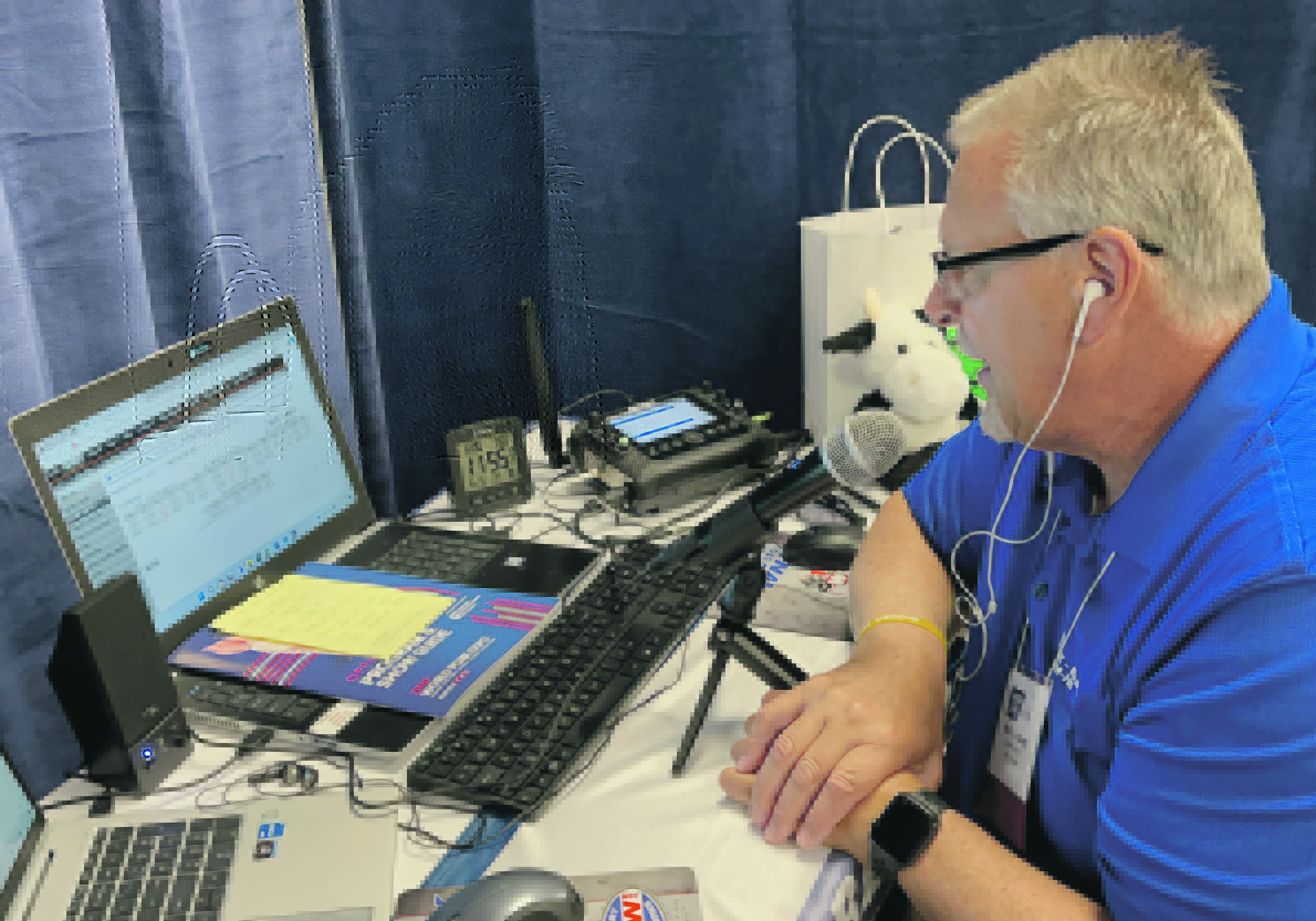 Keith Lundburg of WNAX prepares his next radio broadcoast at the World Pork Expo in Des Moine, Iowa, earlier this summer.  |  Ed White photo