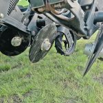 The double-disc openers on the K-Hart Spyder drill run straight ahead but tilted to the side on a 22.5 degree angle, which creates an angled furrow for seed placement. | Scott Garvey photo