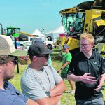 Marcel Kringe of Bushel Plus speaks to farmers at Ag in Motion in July. The company emphasizes sharing knowledge with farmers to help reduce their combine losses to a goal of less than one bushel per acre. | Michael Robin photo