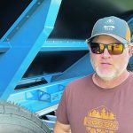 Brad Ferguson in front of his new Walkabout Mother Bin at Ag in
Motion in July. | Michael Robin photo