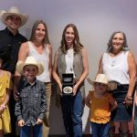 Cassie Marchand (centre) poses with the Schellenberg family, including Reg’s son Coy, daughter-in-law Lauralie, wife Shannon and grandchildren Ella, Nora, Ty and Faye. | Canadian Cattle Association photo