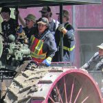 Students practise driving a steam traction engine during Steam School held in Austin, Man., earlier this month. | Geralyn Wichers photo