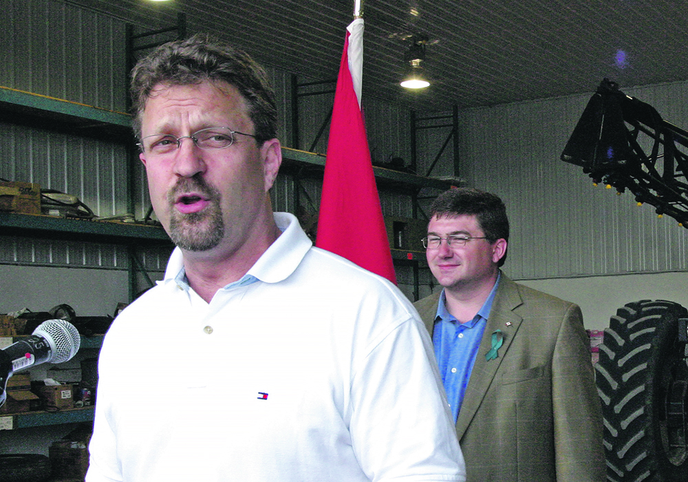Federal agriculture minister Chuck Strahl, then the federal agriculture, announces a new  program to compensate farmers for flooded farmland on a farm near Ste. Adolphe, Man., in the spring of 2006.  |  File photo