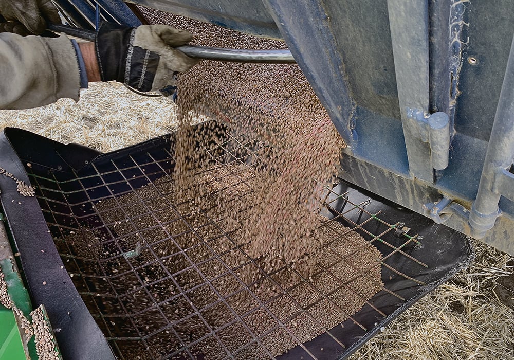 Safe grain handling practices include using caution around all moving equipment such as PTOs and augers and ensuring all protective guards and screens are in place before operating. | File photo