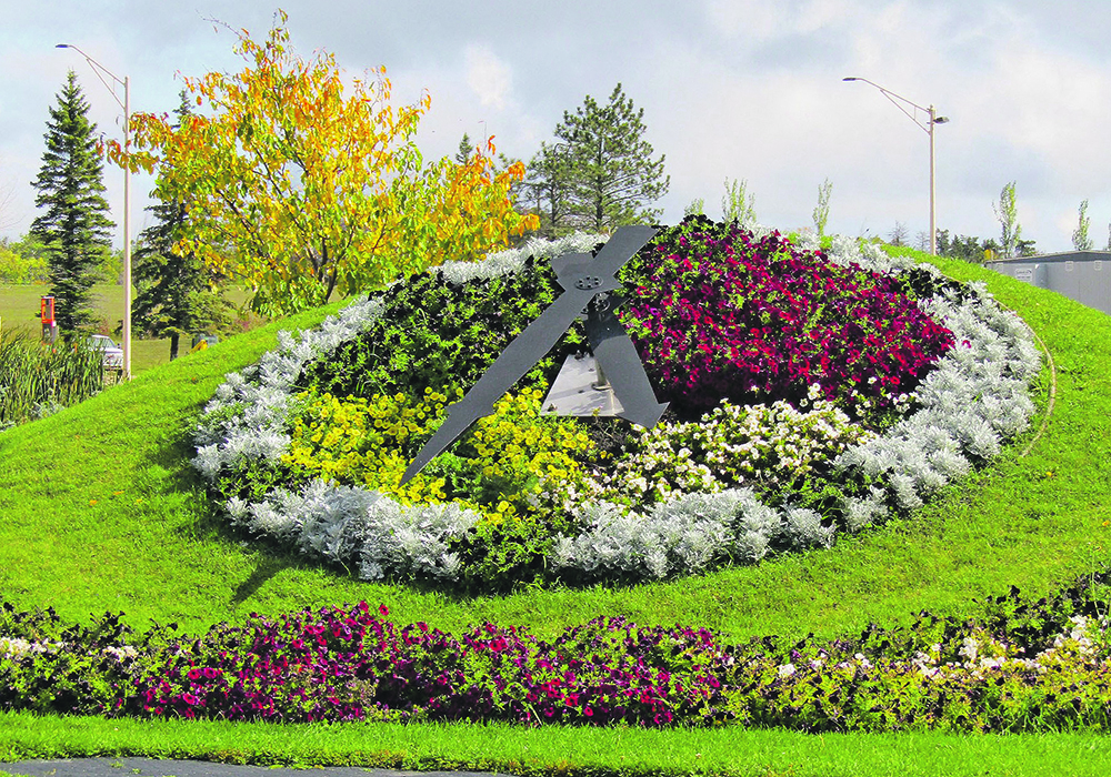 Flowers make up the face of a giant clock near the entrance of the International Peace Gardens.  |  Donna Gamache photo