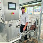 Lester Martin stands with his Uddermatic automated calf feeding system at the Dairy Innovation Centre during Canada’s Outdoor Farm Show. | Stew Slater photo