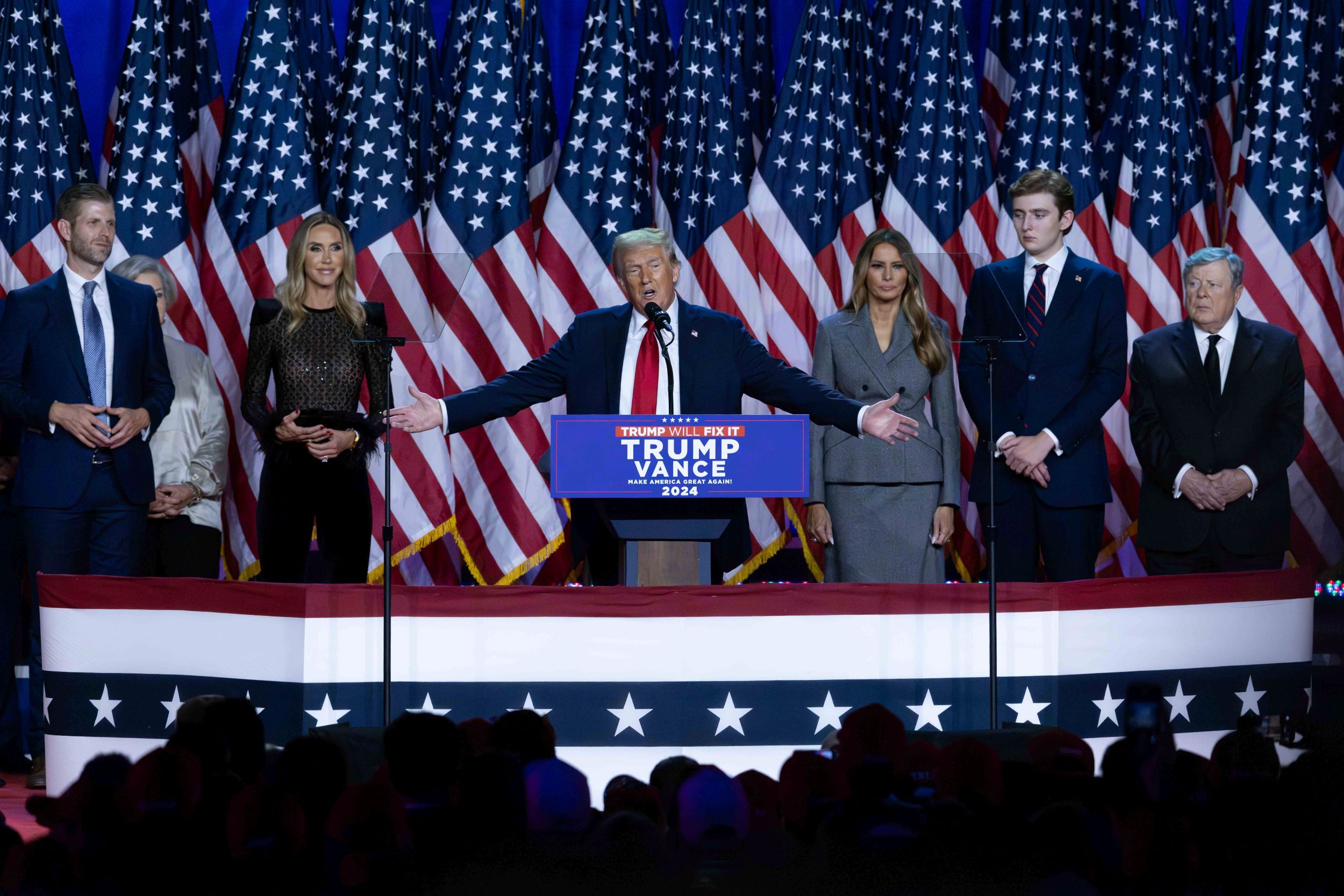 Surrounded by family members and supporters, Donald Trump makes his acceptance speech at his Election Night Watch Party at the Palm Beach County Convention Center after being elected the 47th President of the United States November 5, 2024. Photo: USA TODAY NETWORK via Reuters Connect