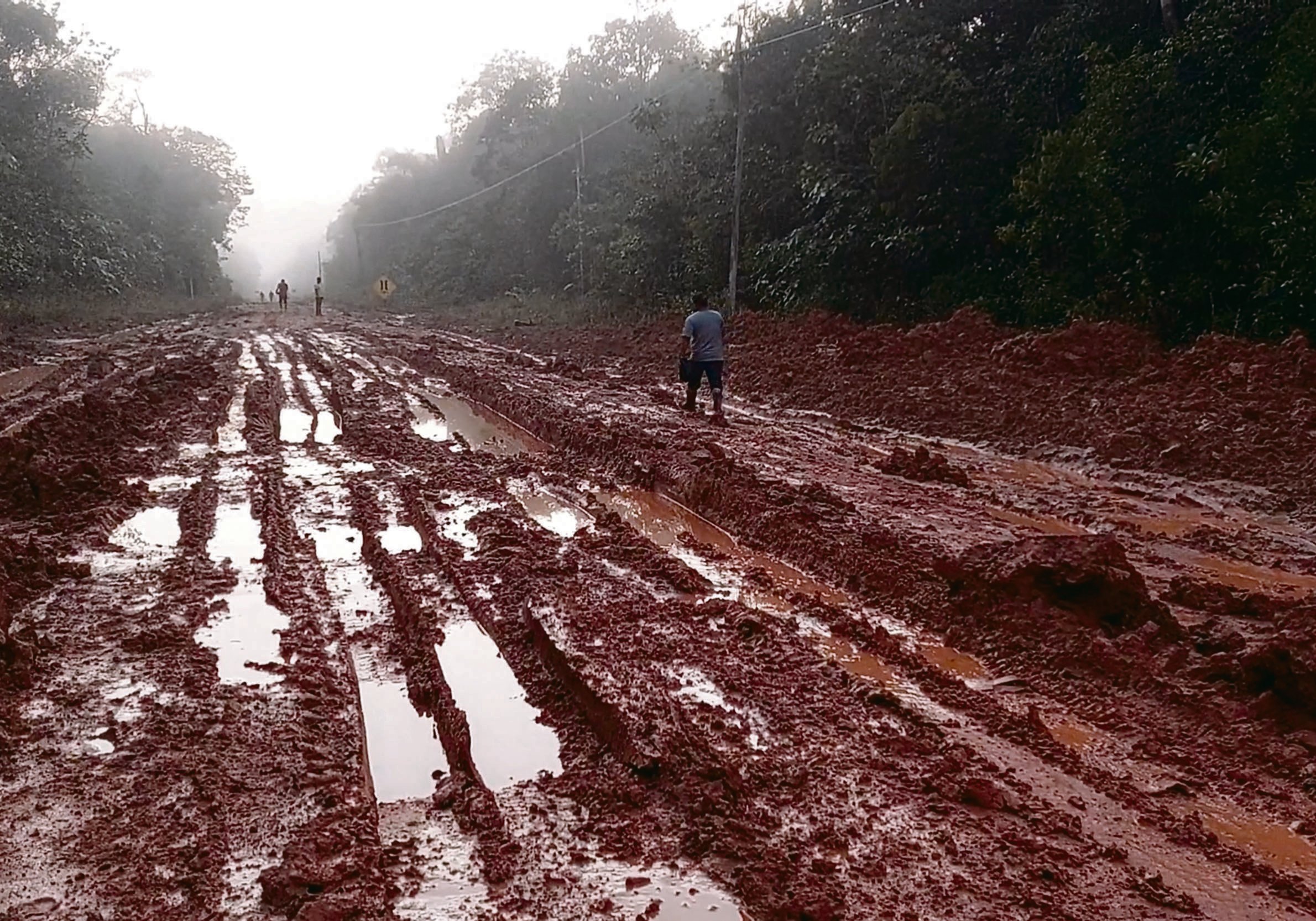 Sections at both ends of Highway BR-319 in Brazil have been paved, but more than 400 kilometres in the middle are still dirt road that turns to impassable mud in the rainy season. Scientists and environmental activists say completion of the road will open access to illegal loggers and miners, as well as farmers who clear the forest by setting fires to open the land for cattle ranching. | REUTERS PHOTO